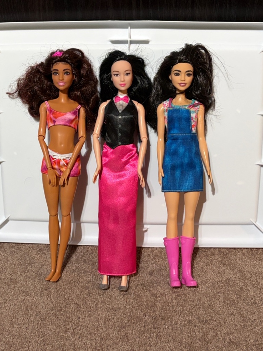 Three Fashion Dolls with Pink and Blue Outfits